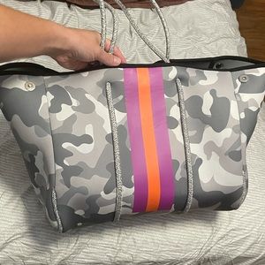 Grey came neoprene purse.